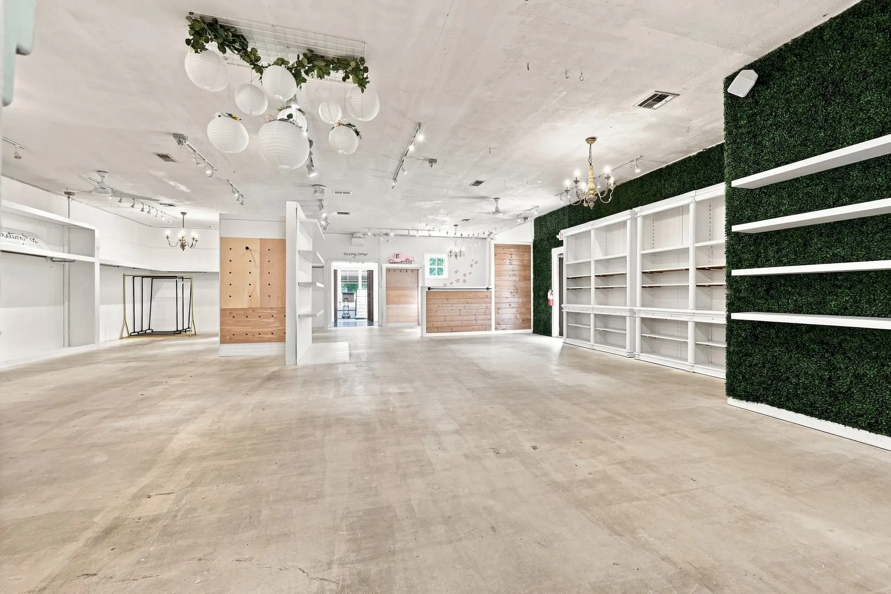 Wide view of the main retail floor showing built-in shelving and open sales area